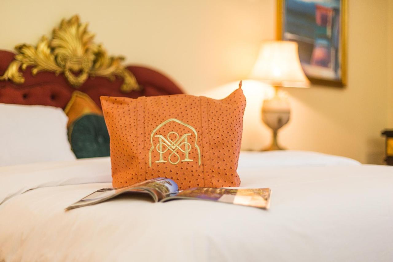 Отель Royal Mirage Deluxe Марракеш Экстерьер фото A pillow with the hotel's logo